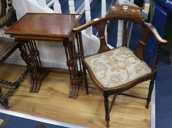 An Edwardian inlaid corner armchair and a nest of 3 tea tables